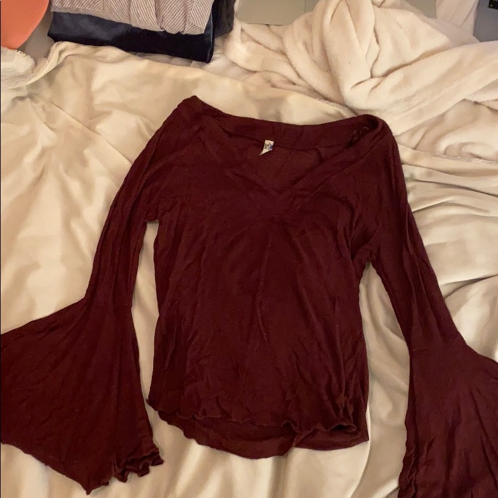 FREE PEOPLE shirt with flowy sleeves.